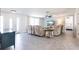 Inviting living room with plush seating, neutral decor, ceiling fan, and abundant natural light at 3348 Pinetree St, Port Charlotte, FL 33952
