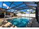 Inviting enclosed pool and patio area, perfect for relaxation and recreation at 3348 Pinetree St, Port Charlotte, FL 33952