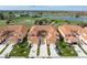 Stunning aerial view of the condo complex, backing onto a lush golf course and serene lake at 3959 San Rocco Dr # 612, Punta Gorda, FL 33950