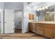 Large bathroom with double sink vanity, walk-in shower, and doorway to the toilet at 3959 San Rocco Dr # 612, Punta Gorda, FL 33950