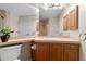 This bathroom features a large mirror, ample cabinet space, neutral countertops, and modern fixtures at 3959 San Rocco Dr # 612, Punta Gorda, FL 33950