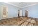 The bright bedroom features wood floors, a ceiling fan, and two entry doors at 3959 San Rocco Dr # 612, Punta Gorda, FL 33950