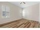 Bright bedroom with wood-look floors, natural light, and a closet enhances the inviting atmosphere at 3959 San Rocco Dr # 612, Punta Gorda, FL 33950