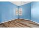 Bright bedroom with wood-look floors and natural light, creating a fresh and inviting living space at 3959 San Rocco Dr # 612, Punta Gorda, FL 33950