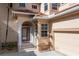 Front exterior featuring a covered entrance, garage, and appealing landscaping at 3959 San Rocco Dr # 612, Punta Gorda, FL 33950