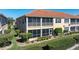 Exterior angle of home featuring a screened lanai and lush landscaping at 3959 San Rocco Dr # 612, Punta Gorda, FL 33950