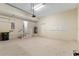 Spacious garage featuring neutral walls, a water heater, and ample room for vehicles and storage at 3959 San Rocco Dr # 612, Punta Gorda, FL 33950