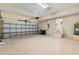 Open garage interior showing ample space, an automatic door, and convenient access stairs at 3959 San Rocco Dr # 612, Punta Gorda, FL 33950