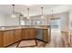 Open kitchen with granite countertops, stainless steel appliances, wood cabinets, and view to back patio at 3959 San Rocco Dr # 612, Punta Gorda, FL 33950