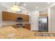 Kitchen with stainless steel appliances, granite countertops, breakfast bar, and plenty of cabinet space at 3959 San Rocco Dr # 612, Punta Gorda, FL 33950