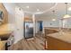 Spacious kitchen with stainless steel appliances, laminate floor, and open layout at 3959 San Rocco Dr # 612, Punta Gorda, FL 33950