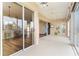 Extended lanai leading to indoor kitchen area, complemented by sliding glass doors offering scenic views at 3959 San Rocco Dr # 612, Punta Gorda, FL 33950