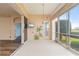 Spacious lanai with sliding glass doors, a mounted television, and scenic views at 3959 San Rocco Dr # 612, Punta Gorda, FL 33950