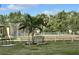 Common green space area with palm trees and benches at 4000 Oakview Dr # L2, Punta Gorda, FL 33980