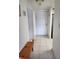 Bright hallway features tile flooring, a bench, a closet, and a white front door at 4000 Oakview Dr # L2, Punta Gorda, FL 33980