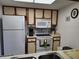 Functional kitchen featuring a range of appliances, ample counter space, and convenient overhead cabinets at 4000 Oakview Dr # L2, Punta Gorda, FL 33980