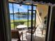 Enclosed porch with view of the lake and the buildings at 4000 Oakview Dr # L2, Punta Gorda, FL 33980