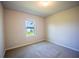 Bedroom featuring neutral paint, carpet flooring and natural light from a window at 421 San Cristobal Ave, Punta Gorda, FL 33983