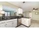 Kitchen featuring white cabinetry, mosaic backsplash, and stainless steel dishwasher at 4255 Beach View Ct, Port Charlotte, FL 33948