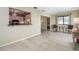 Bright living room features neutral tile floors and adjoins the kitchen at 4255 Beach View Ct, Port Charlotte, FL 33948