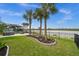 Beautiful waterfront backyard with mature landscaping and lake views at 42998 Wiregrass Ln, Punta Gorda, FL 33982