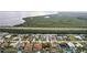 Stunning aerial view of waterfront homes, each with a private pool and boat dock, backing up to a scenic waterway at 5244 Early Ter, Port Charlotte, FL 33981