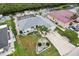 A beautiful aerial view of a well-maintained property including landscaping, and waterfront access at 5244 Early Ter, Port Charlotte, FL 33981