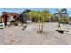 Backyard has white rock landscaping, brick pavers, and a view of the enclosed lanai at 5244 Early Ter, Port Charlotte, FL 33981