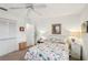 Bright bedroom featuring closet, beach themed art, desk, and decorative side lamps at 5244 Early Ter, Port Charlotte, FL 33981