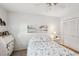 Bright bedroom featuring closet, lake themed art, desk, and decorative bedside lamps at 5244 Early Ter, Port Charlotte, FL 33981
