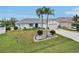 Beautiful single-story home with a two-car garage, ample driveway space, and meticulous landscaping at 5244 Early Ter, Port Charlotte, FL 33981
