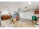 Spacious garage with ceiling fan, ample storage space, and a garage door opener at 5244 Early Ter, Port Charlotte, FL 33981