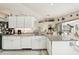 Spacious kitchen with granite counters, white cabinets, and an open layout to the living areas at 5244 Early Ter, Port Charlotte, FL 33981