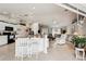 Open concept kitchen with island seating, granite countertops and seamless flow to living room at 5244 Early Ter, Port Charlotte, FL 33981