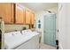 Laundry room features a utility sink and storage cabinets above the washer and dryer at 5244 Early Ter, Port Charlotte, FL 33981