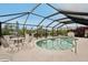 Enjoy this enclosed pool with an outdoor dining set for entertaining and relaxation at 5244 Early Ter, Port Charlotte, FL 33981