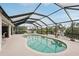 Inviting enclosed pool, perfect for cooling off on hot days and enjoying the outdoors at 5244 Early Ter, Port Charlotte, FL 33981