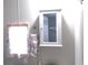 Bright bathroom features mirrors, towel rack with hanging towel, and medicine cabinet for convenient storage at 5632 Holiday Park Blvd, North Port, FL 34287