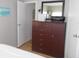 Bedroom featuring a large brown dresser, decor, and natural light from the window at 5632 Holiday Park Blvd, North Port, FL 34287