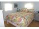 Comfortable bedroom with natural light and light walls with a bed at 5632 Holiday Park Blvd, North Port, FL 34287