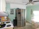 Bright kitchen featuring stainless steel appliances, tile flooring, and an eat-in area at 5632 Holiday Park Blvd, North Port, FL 34287