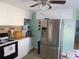 Bright kitchen featuring stainless steel appliances, tile flooring, and plenty of cabinet space at 5632 Holiday Park Blvd, North Port, FL 34287