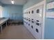 Clean and organized laundry room with multiple machines and folding area for easy laundry days at 5632 Holiday Park Blvd, North Port, FL 34287