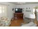 Inviting living room features hardwood floors and ample space for relaxation and entertainment at 5632 Holiday Park Blvd, North Port, FL 34287