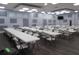 Spacious meeting room with tables, chairs, and soft lighting great for gatherings and community events at 5632 Holiday Park Blvd, North Port, FL 34287