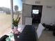 Enjoy outdoor dining on this screened patio, featuring a table, chairs, and a glimpse of the outdoors at 5632 Holiday Park Blvd, North Port, FL 34287