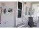 Comfortable screened porch with seating area, perfect for enjoying the outdoors at 5632 Holiday Park Blvd, North Port, FL 34287