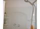Shower with white molded surround, updated fixture, grab bar, and convenient shelving for toiletries at 5632 Holiday Park Blvd, North Port, FL 34287
