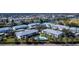Enjoy the community pool and surrounding waterways in this beautiful aerial view of the complex at 5725 Greenwood Ave # 3104, North Port, FL 34287