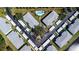 Overhead view of condos featuring a symmetrical layout and a central pool area at 5725 Greenwood Ave # 3104, North Port, FL 34287